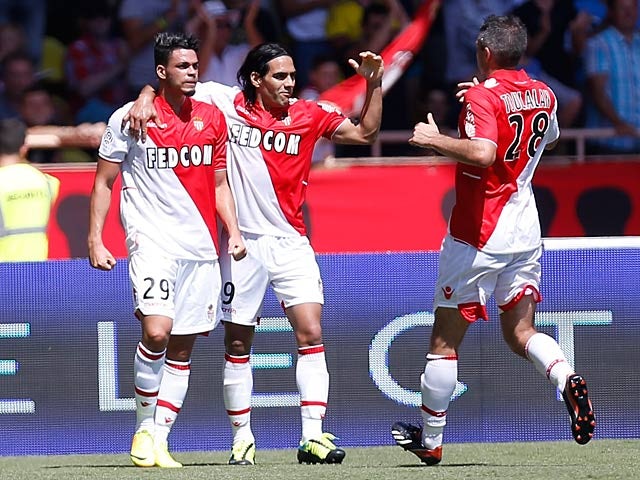 Monaco's Emmanuel Riviere is congratulated by team mates Radamel Falcao and Jeremy Toulalan after scoring his team's second goal against Montpellier on August 18, 2013