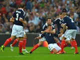 James Morrison of Scotland celebrates with team-mates after scoring a goal during the International Friendly match between England and Scotland at Wembley Stadium on August 14, 2013