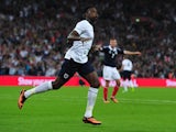 England striker Danny Welbeck celebrates scoring his team's second goal during the international friendly football match between England and Scotland at Wembley Stadium in London on August 14, 2013