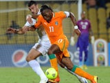 Algeria defender Essaid Belkalem battles with Didier Droga of the Ivory Coast during the Africa Cup of Nations of January 30, 2013