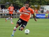 Lorient's French forward Jeremie Aliadiere runs with the ball during a French L1 friendly football match between Lorient and Rennes on July 24, 2013