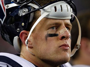 J.J. Watt #99 of the Houston Texans looks on from the sidelines against the New England Patriots during the 2013 AFC Divisional Playoffs game at Gillette Stadium on January 13, 2013