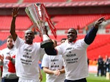 Abdul Osman and Chuks Aneke of Crewe Alexandra celebrates with the trophy during the Johnstone's Paint Trophy Final match between Crewe Alexandra and Southend United at Wembley Stadium on April 7, 2013