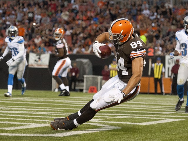 Tight end Jordan Cameron #84 of the Cleveland Browns catches a touchdown pass during the first half of a preseason at FirstEnergy Stadium on August 15, 2013