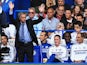 Chelsea manager Jose Mourinho waves to the crowd as he is welcomed back Chelsea fans before kick off against Hull on August 18, 2013