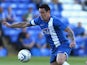 Lee Tomlin of Peterborough United runs with the ball during the pre season friendly match between Peterborough United and Hull City at London Road Stadium on July 29, 2013