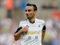 Leon Britton of Swansea in action during the UEFA Europa League third round qualifying first leg match between Swansea City and Malmo at the Liberty Stadium on August 1, 2013