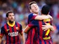 Barcelona's Lionel Messi is congratulated by team mate Pedro after scoring his team's second goal against Levante on August 18, 2013