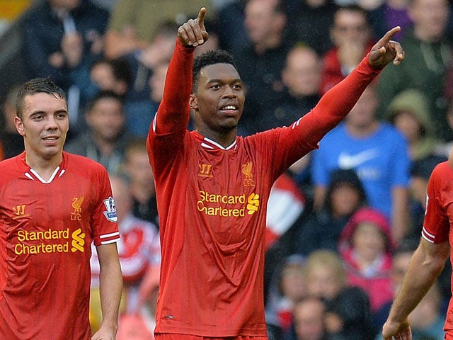 Liverpool's English forward Daniel Sturridge celebrates after scoring his team's first goal during the season's opening English Premier League football match between Liverpool and Stoke City on August 17, 2013
