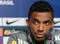 Brazil's midfielder Luiz Gustavo listens to comments during a press conference in Rio de Janeiro on June 28, 2013