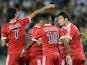 Lyon's French midfielder Yoann Gourcuff celebrates with teammates after scoring a goal during the French L1 football match agaisnt Sochaux on August 16, 2013