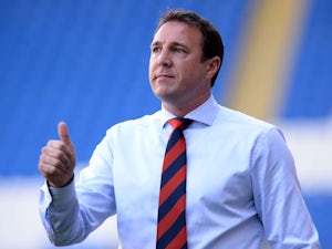 Cardiff City manager Malky Mackay shouts instructions to his team during the Cardiff City v Chievo Verona Pre Season Friendly game at the Cardiff City Stadium on August 3, 2013