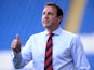 Cardiff City manager Malky Mackay shouts instructions to his team during the Cardiff City v Chievo Verona Pre Season Friendly game at the Cardiff City Stadium on August 3, 2013