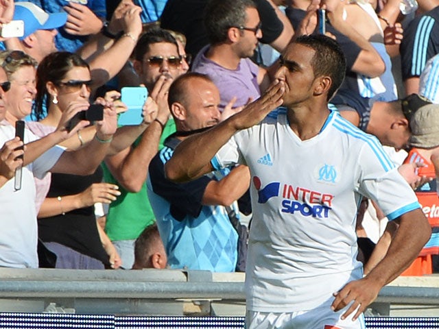 Marseille's French forward Dimitri Payet celebrates after scoring his team's second goal during the French L1 football match between Olympique of Marseille and Evian at the Velodrome stadium in Marseille, on August 17, 2013