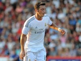Mesut Ozil of Real Madrid attacks during the pre season friendly match between Bournemouth and Real Madrid at Goldsands Stadium on July 21, 2013