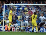 James Vaughan of Huddersfield scores the opening goal during the Sky Bet Championship match between Millwall and Huddersfield Town at The Den on August 17, 2013