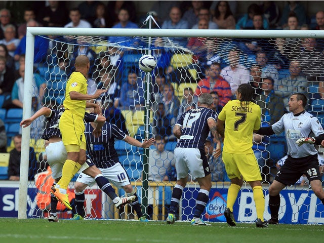 James Vaughan of Huddersfield scores the opening goal during the Sky Bet Championship match between Millwall and Huddersfield Town at The Den on August 17, 2013