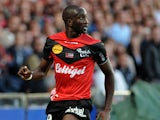 Guingamp's French-Malian forward Mustapha Yatabare runs with the ball during the French L1 football match between Guingamp and Marseille on August 11, 2013