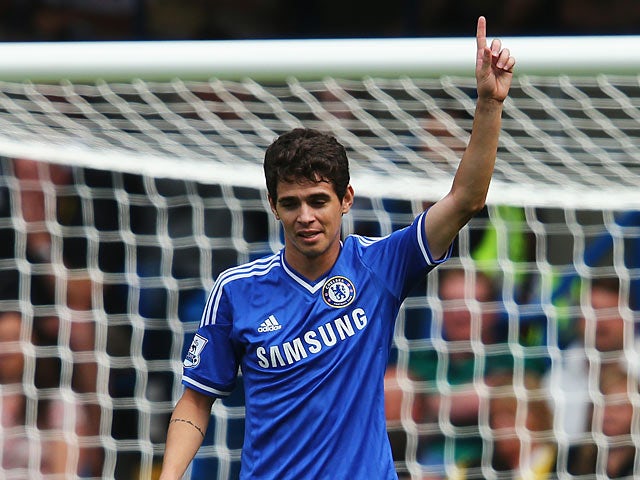 Chelsea's Oscar celebrates scoring the opening goal against Hull on August 18, 2013