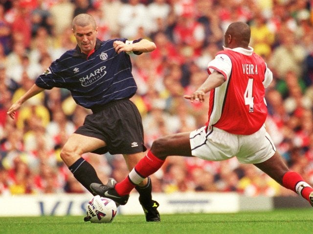 Patrick Vieira and Roy Keane challenge for possession.
