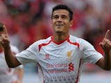 English Premier League football club Liverpool player Philippe Coutinho celebrates after scoring against Thailand at Rajamangala National Stadium in Bangkok on July 28, 2013