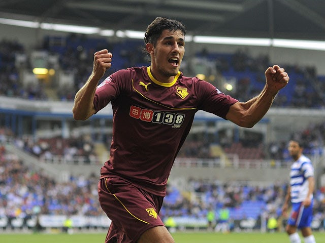 Marco Faraoni of Watford celebrates after scoring the teams first goal during the Sky Bet Championship match between Reading v Watford at The Madejski Stadium on August 17, 2013
