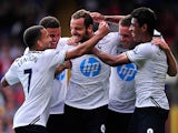Spurs' Roberto Soldado is congratulated by team mates after scoring the opening goal against Crystal Palace on August 18, 2013