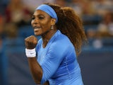 Serena Williams celebrates a point against Mona Barthel of Germany during the Western & Southern Open on August 15, 2013