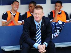 Steve Lomas, manager of Millwall looks on from the dugout before the Sky Bet Championship match between Millwall and Yeovil Town at The Den on August 03, 2013 