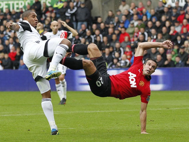 Manchester United's Dutch striker Robin van Persie scores the opening goal during the English Premier League football match between Swansea City and Manchester United at Liberty Stadium in Swansea, south Wales, on August 17, 2013
