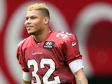 Safety Tyrann Mathieu of the Arizona Cardinals walks out onto the field during the team training camp at University of Phoenix Stadium on July 26, 2013