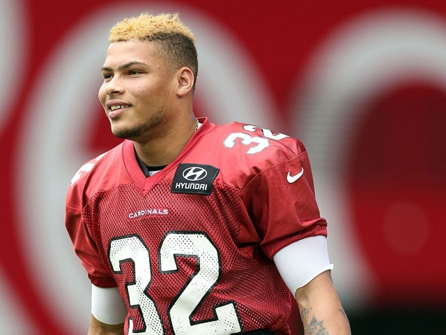 Safety Tyrann Mathieu of the Arizona Cardinals walks out onto the field during the team training camp at University of Phoenix Stadium on July 26, 2013