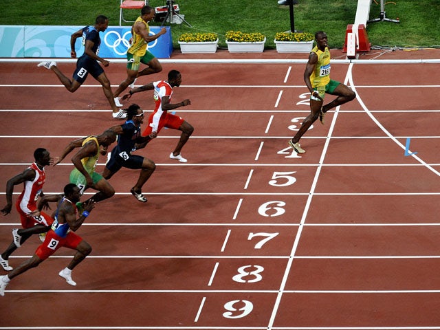 Jamaica's Usain Bolt crosses the finish line to win the men's 100m final at the 2008 Olympic Games on August 16, 2008