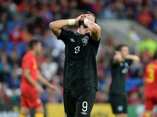 Ireland number 9 Shane Long shows his frustration after missing a shot on goal during the International Friendly match between Wales v Ireland at the Cardiff City Stadium on August 14, 2013