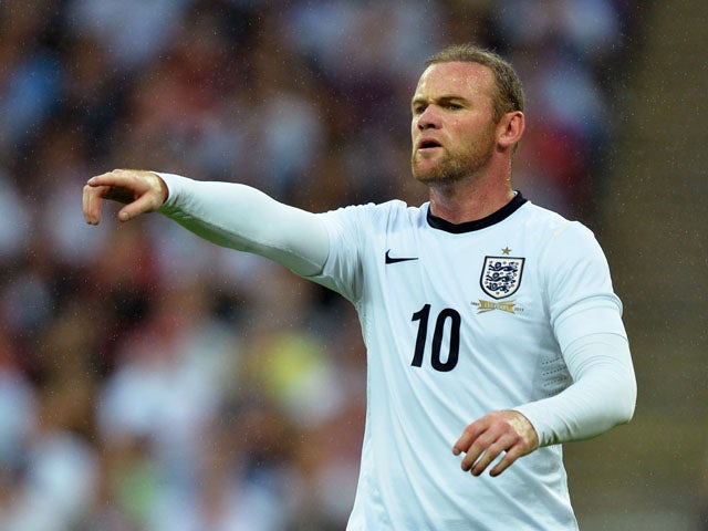 Wayne Rooney of England gestures during the International Friendly match between England and Scotland at Wembley Stadium on August 14, 2013