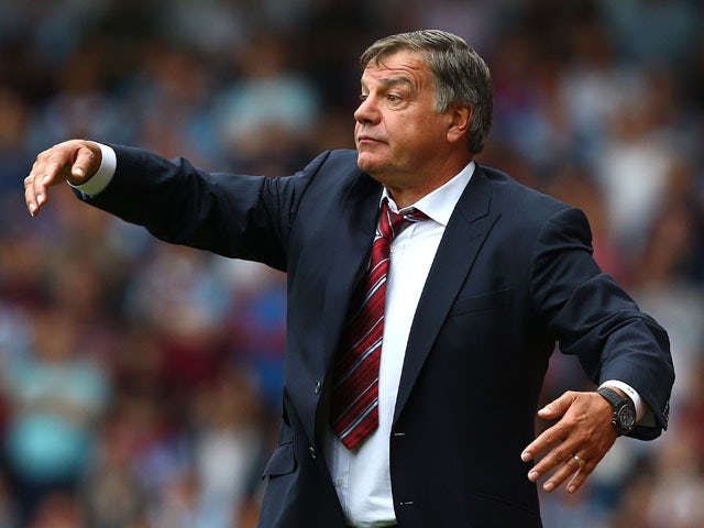 Manager of West Ham Sam Allardyce directs the team during the Barclays Premier League match between West Ham United and Cardiff City at the Bolyen Ground on August 17, 2013
