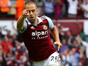 Joe Cole of West Ham United celebrates his goal during the Barclays Premier League match between West Ham United and Cardiff City at the Bolyen Ground on August 17, 2013