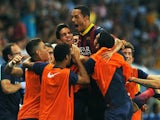 Barca's Adriano is congratulated by teammates after a goal against Malaga on August 25, 2013