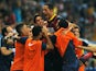 Barca's Adriano is congratulated by teammates after a goal against Malaga on August 25, 2013