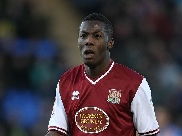 Akwasi Asante of Northampton Town in action during the npower League Two match between Shrewsbury Town and Northampton Town at the Greenhous Meadow on January 2, 2012
