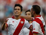 Rayo's Alberto Bueno celebrates with teammates after scoring against Elche on August 19, 2013