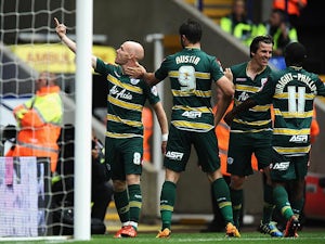 QPR's Andy Johnson celebrates with team mates after scoring the opening goal against Bolton on August 24, 2013
