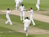 Australian players celebrate during play on the third day of the fifth Ashes cricket test match between England and Australia at the Oval in London on August 23, 2013