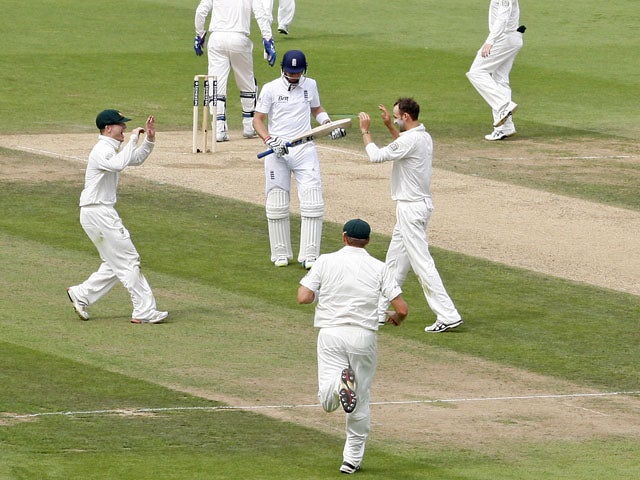 Australian players celebrate during play on the third day of the fifth Ashes cricket test match between England and Australia at the Oval in London on August 23, 2013