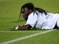 Lyon's Bafetimbi Gomis lays on the ground during a game with PSG on May 12, 2013