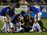 David Symington of Carlisle United is congratulated by team mates after scoring the winning goal in the penalty shoot out during the Capital One Cup first round match between Carlisle United and Blackburn Rovers at Brunton Park on August 7, 2013