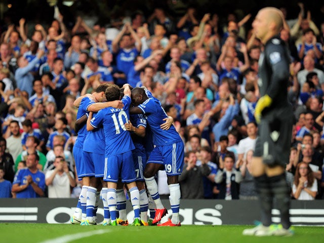 Chelsea players celebrate the first goal in their Premier League clash with Aston Villa on August 21, 2013