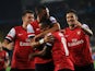 Arsenal's players celebrate their goal against Fenerbahce during their UEFA Champions League Play Off first leg match at Sukru Saracoglu Stadium in Istanbul on August 21, 2013