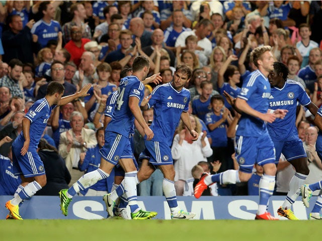 Branislav Ivanovic of Chelsea is congratulated by teammates after scoring his team's second goal during the Barclays Premier League match between Chelsea and Aston Villa at Stamford Bridge on August 21, 2013