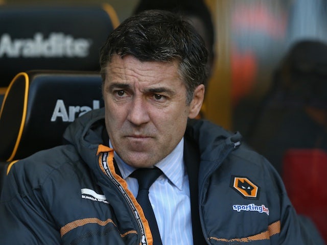 Then Wolves boss Dean Saunders, sitting in the dugout on April 16, 2013